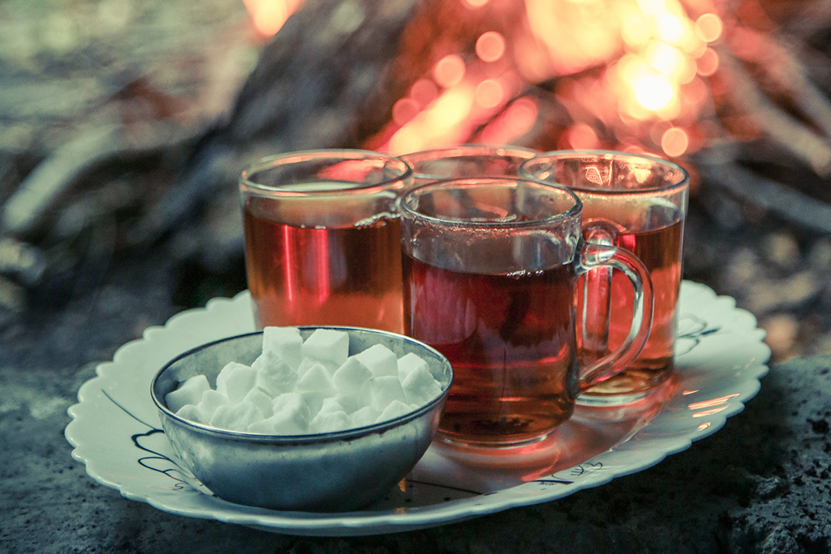 A tray of four cups of tea.