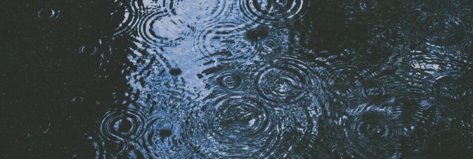 Blue puddle of water covered in ripples